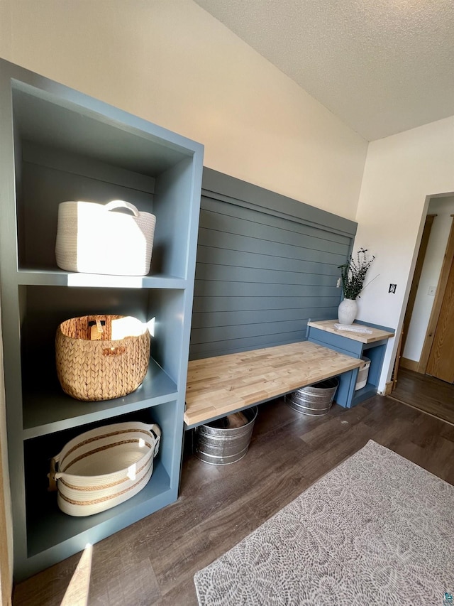 7789 Jokela Rd, Cloquet, MN 55720 - mudroom featuring wood finished floors, a textured ceiling, and baseboards