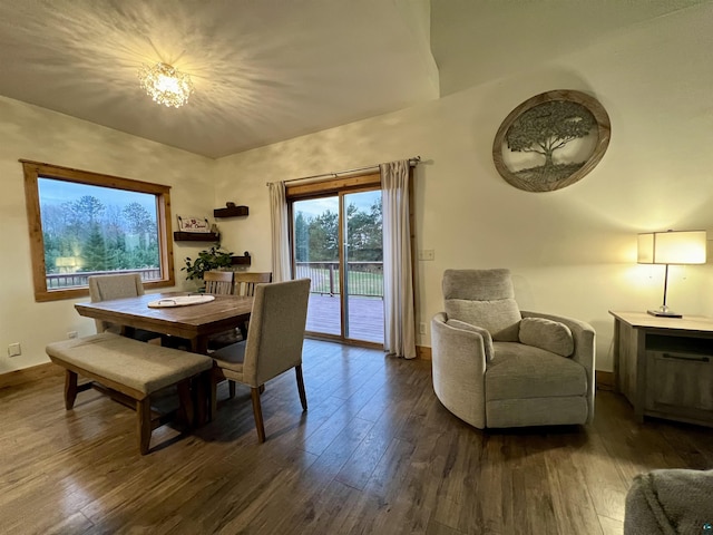 7789 Jokela Rd, Cloquet, MN 55720 - dining area with hardwood / wood-style floors, baseboards, and a chandelier