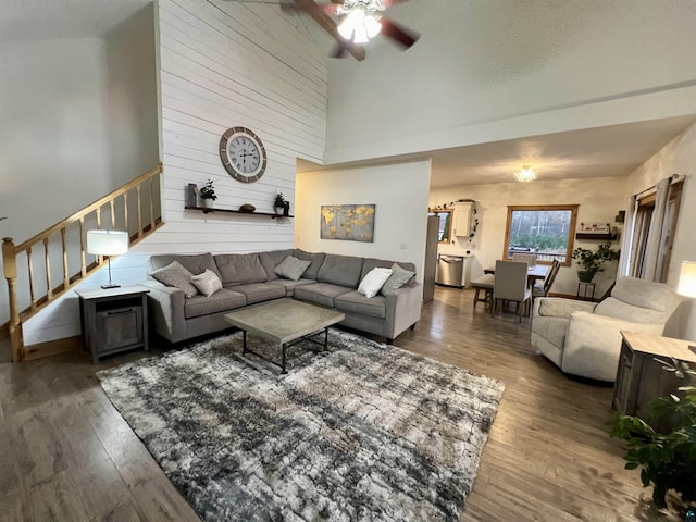 7789 Jokela Rd, Cloquet, MN 55720 - living room with stairs, ceiling fan, hardwood / wood-style floors, and a high ceiling
