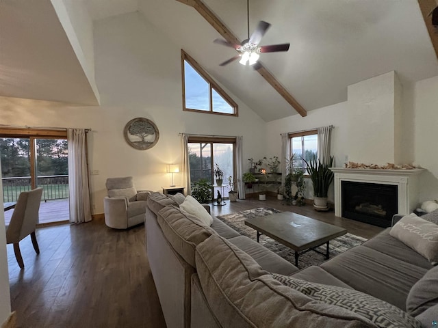 7789 Jokela Rd, Cloquet, MN 55720 - living room featuring high vaulted ceiling, ceiling fan, dark wood-style floors, a fireplace, and beam ceiling