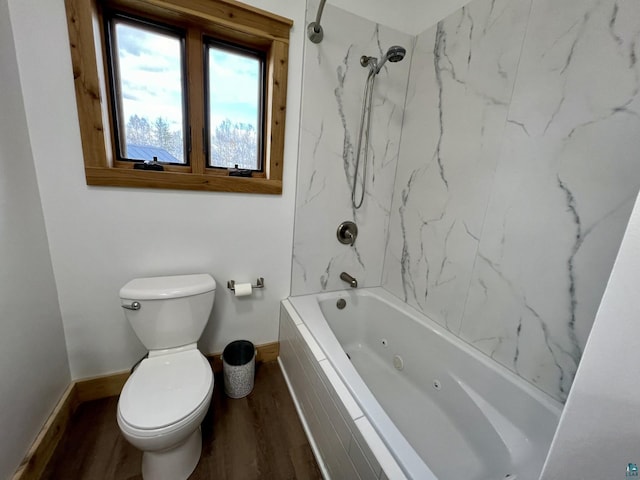 7789 Jokela Rd, Cloquet, MN 55720 - full bathroom featuring wood finished floors, baseboards, toilet, and shower / tub combination