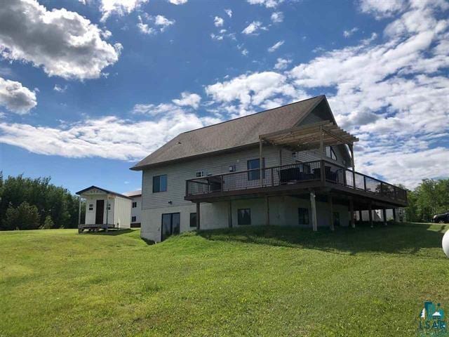 7789 Jokela Rd, Cloquet, MN 55720 - rear view of property featuring a yard, a deck, and a pergola
