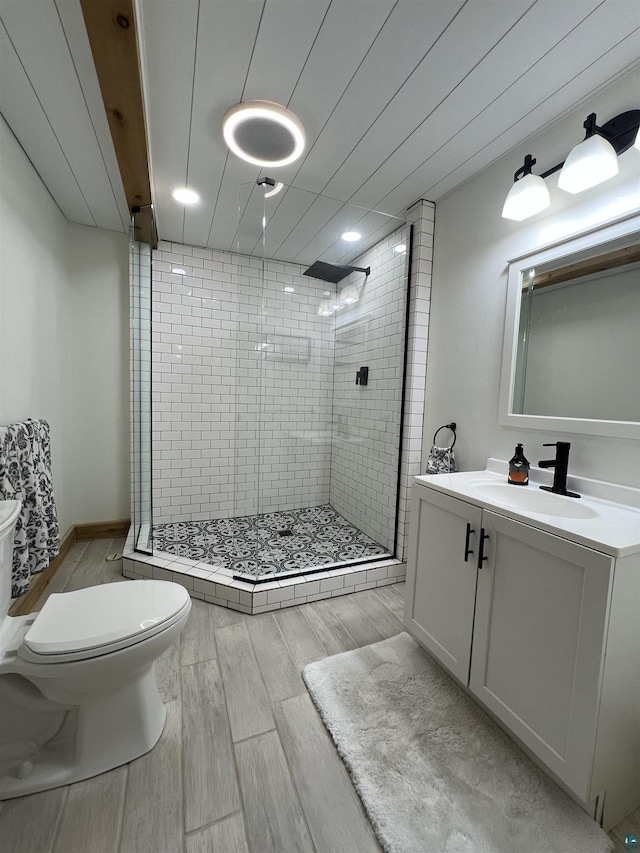 7789 Jokela Rd, Cloquet, MN 55720 - full bath featuring toilet, a stall shower, and wood finished floors