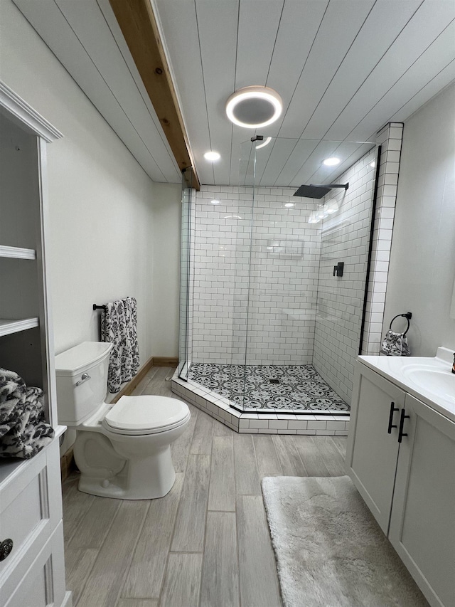 7789 Jokela Rd, Cloquet, MN 55720 - bathroom featuring toilet, wood finished floors, a shower stall, and vanity