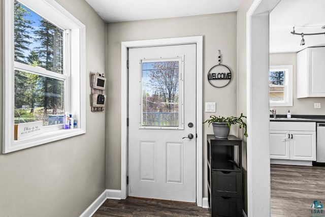 426 22nd St, Cloquet, MN 55720 - doorway with dark wood finished floors and baseboards