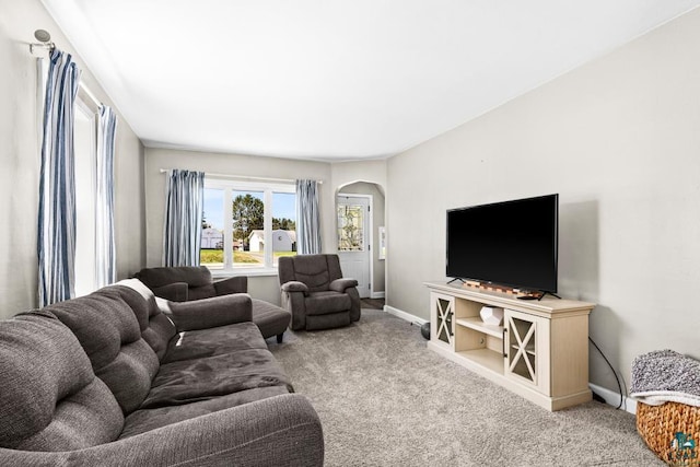 426 22nd St, Cloquet, MN 55720 - carpeted living area featuring arched walkways and baseboards