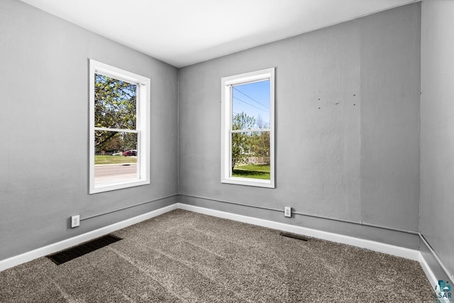 426 22nd St, Cloquet, MN 55720 - unfurnished room with carpet, plenty of natural light, and baseboards