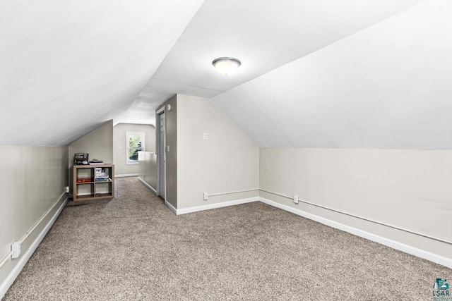 426 22nd St, Cloquet, MN 55720 - bonus room with carpet flooring, lofted ceiling, and baseboards