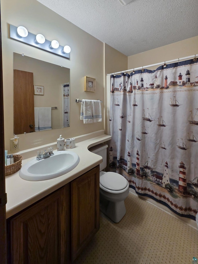 256 Middle Rd Unit 204, Lapointe, WI 54850 - bathroom featuring vanity, toilet, a textured ceiling, and a shower with shower curtain