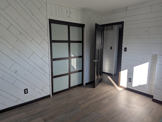 81 Edison Blvd, Silver Bay, MN 55614 - spare room with dark wood-type flooring and wooden walls