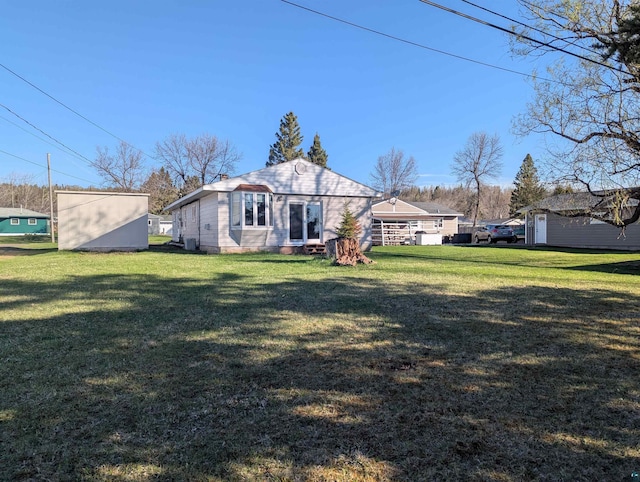 81 Edison Blvd, Silver Bay, MN 55614 - back of house with a lawn