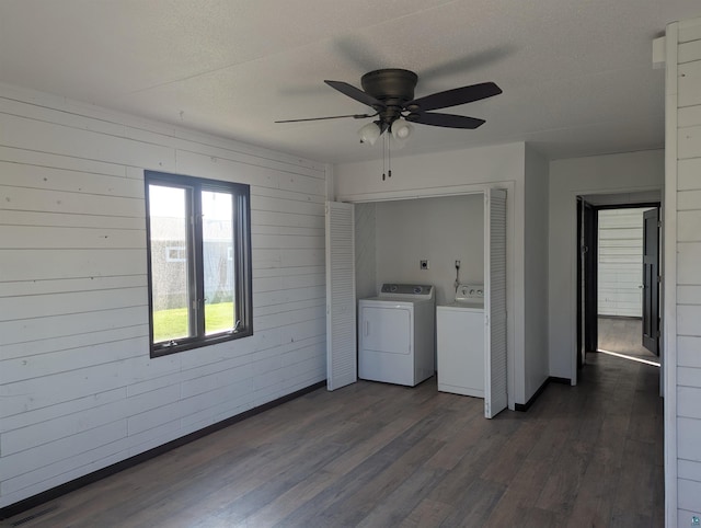 81 Edison Blvd, Silver Bay, MN 55614 - laundry room featuring washing machine and clothes dryer, a ceiling fan, dark wood finished floors, wooden walls, and a textured ceiling