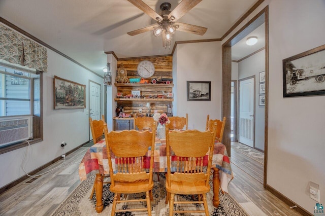10173 Little Marais Trl, Silver Bay, MN 55614 - dining area with ornamental molding, ceiling fan, wood finished floors, baseboards, and cooling unit