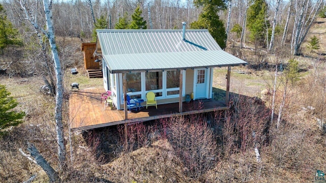 10173 Little Marais Trl, Silver Bay, MN 55614 - rear view of house with a wooden deck and metal roof