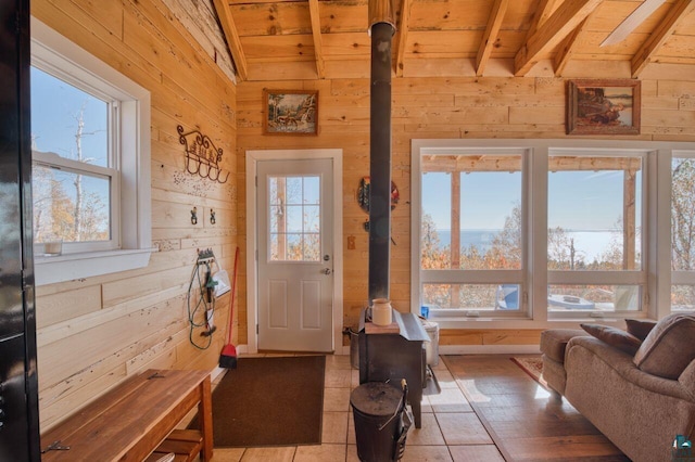 10173 Little Marais Trl, Silver Bay, MN 55614 - doorway with wood walls, wooden ceiling, and a wood stove