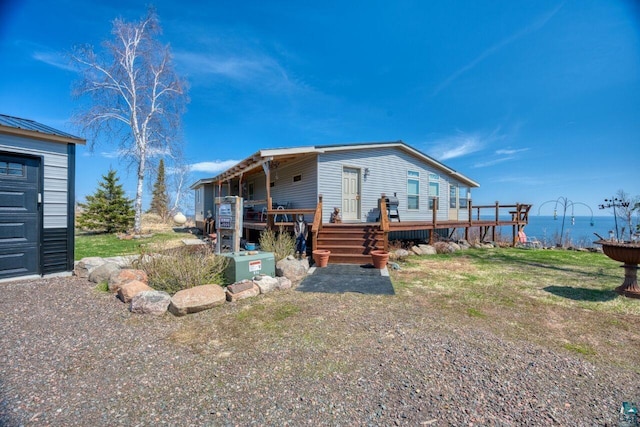 10173 Little Marais Trl, Silver Bay, MN 55614 - view of front of home with a deck with water view