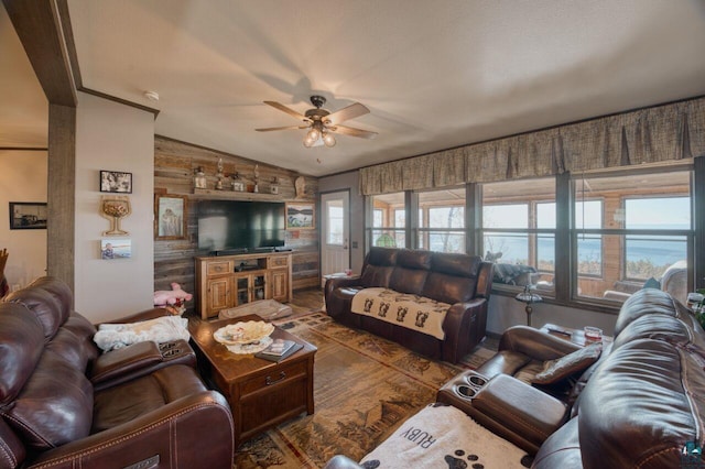10173 Little Marais Trl, Silver Bay, MN 55614 - living room featuring ceiling fan, vaulted ceiling, and wood walls