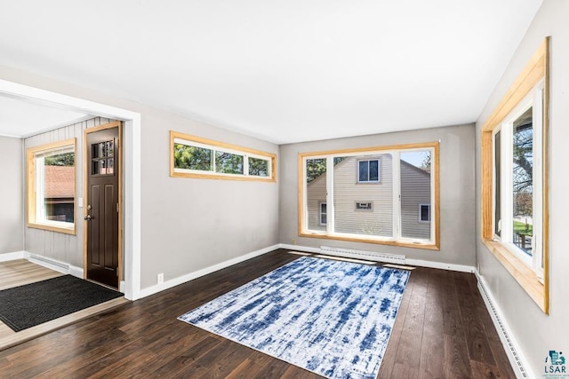 2106 Piedmont Ave, Duluth, MN 55811 - entryway featuring a baseboard heating unit, baseboards, and dark wood-style floors