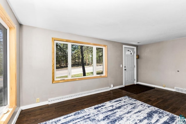 2106 Piedmont Ave, Duluth, MN 55811 - foyer featuring baseboard heating, wood finished floors, and baseboards