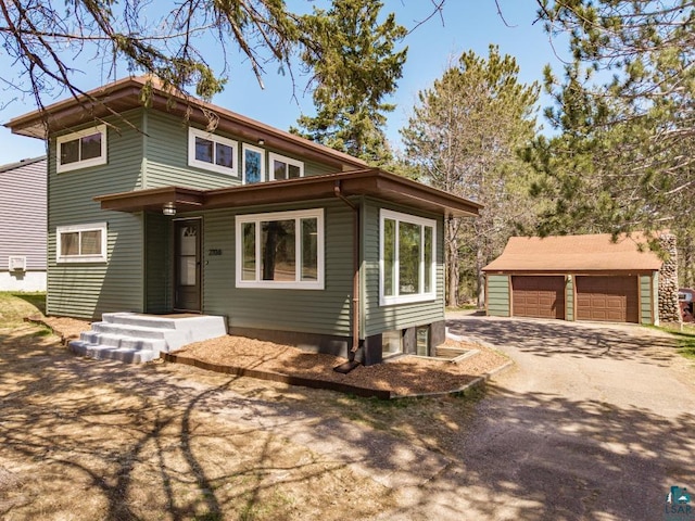 2106 Piedmont Ave, Duluth, MN 55811 - view of front of home with a detached garage and an outdoor structure