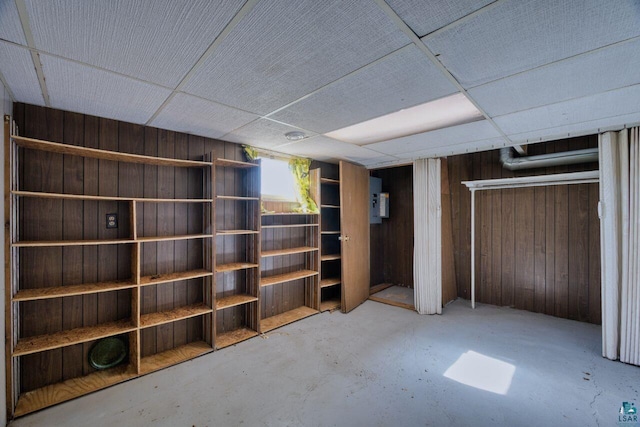 4538 Bass Lake Rd, Gilbert, MN 55741 - below grade area with wood walls and a paneled ceiling