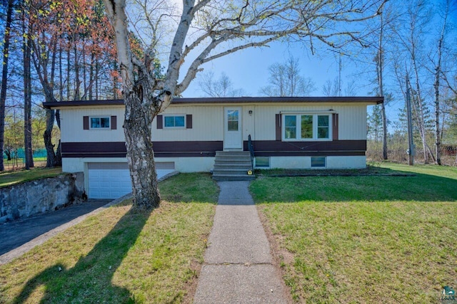 4538 Bass Lake Rd, Gilbert, MN 55741 - view of front facade featuring an attached garage, asphalt driveway, and a front yard
