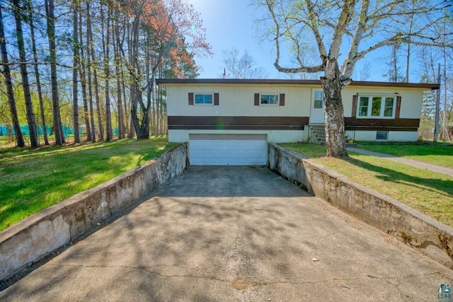 4538 Bass Lake Rd, Gilbert, MN 55741 - view of front of property featuring concrete driveway, an attached garage, and a front yard