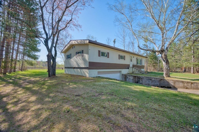 4538 Bass Lake Rd, Gilbert, MN 55741 - rear view of house with a yard and a garage