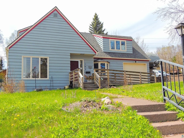 103 3rd Ave W, Grand Marais, MN 55604 - bungalow with a deck, roof with shingles, and fence