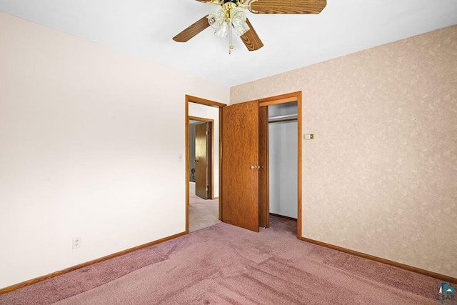 3026 Getchell Rd, Duluth, MN 55810 - unfurnished bedroom with carpet flooring, a closet, baseboards, and ceiling fan