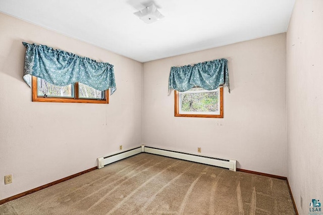 3026 Getchell Rd, Duluth, MN 55810 - spare room featuring carpet floors, baseboards, and a baseboard radiator