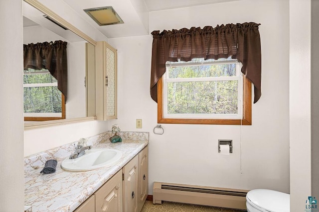 3026 Getchell Rd, Duluth, MN 55810 - half bathroom with baseboard heating, vanity, and toilet