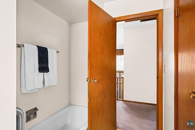 3026 Getchell Rd, Duluth, MN 55810 - bathroom featuring a tub and baseboards