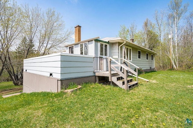 3026 Getchell Rd, Duluth, MN 55810 - rear view of house featuring a chimney and a lawn