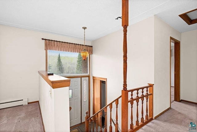 3026 Getchell Rd, Duluth, MN 55810 - hallway featuring an upstairs landing, carpet floors, a baseboard heating unit, and baseboards