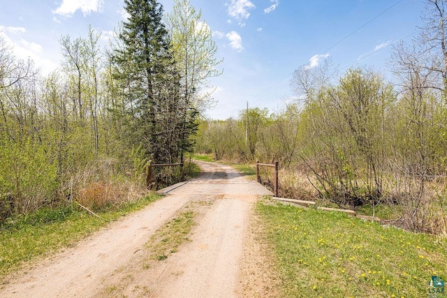 3026 Getchell Rd, Duluth, MN 55810 - view of dirt / gravel road featuring a wooded view