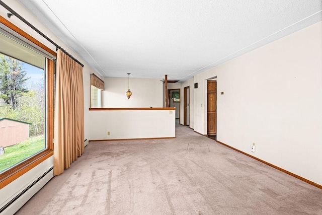 3026 Getchell Rd, Duluth, MN 55810 - carpeted empty room featuring a baseboard heating unit, baseboards, and baseboard heating