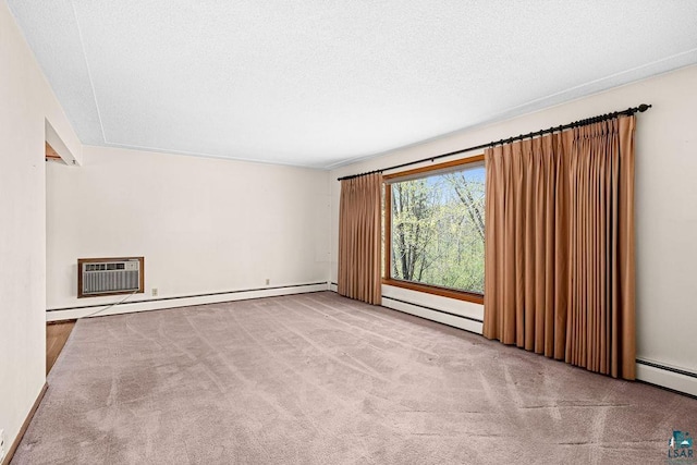 3026 Getchell Rd, Duluth, MN 55810 - carpeted empty room with a baseboard radiator, a wall mounted AC, and a textured ceiling