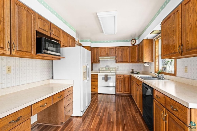 3026 Getchell Rd, Duluth, MN 55810 - kitchen featuring white appliances, a sink, under cabinet range hood, dark wood-style flooring, and light countertops