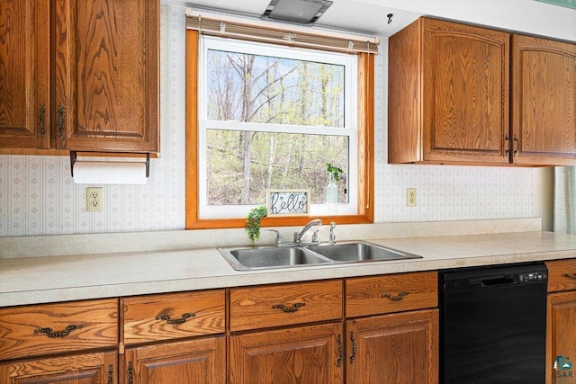 3026 Getchell Rd, Duluth, MN 55810 - kitchen featuring dishwasher, wallpapered walls, a sink, light countertops, and brown cabinets