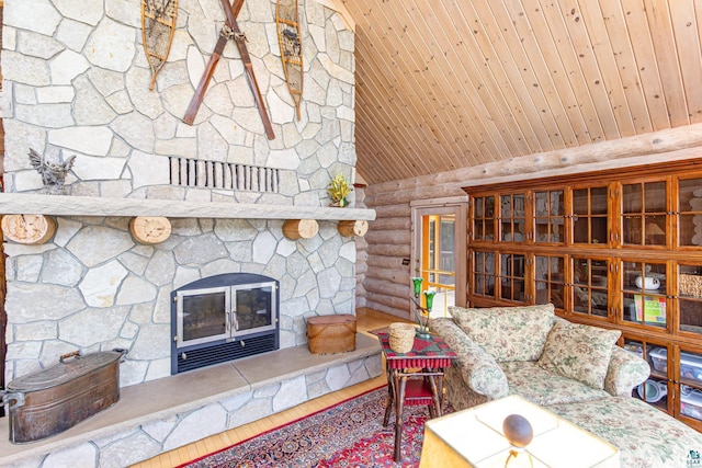 693 Kawishiwi Trl, Ely, MN 55731 - living room with rustic walls, a stone fireplace, wood ceiling, wood finished floors, and vaulted ceiling