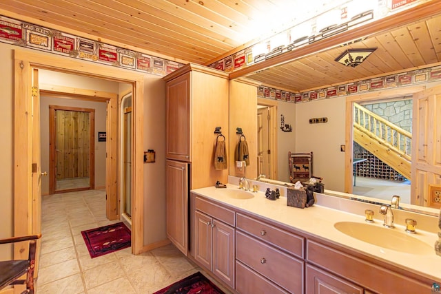 693 Kawishiwi Trl, Ely, MN 55731 - full bathroom featuring wooden ceiling, double vanity, and tile patterned floors