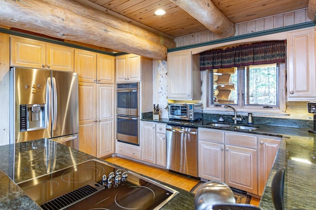 693 Kawishiwi Trl, Ely, MN 55731 - kitchen with stainless steel appliances, wood ceiling, beamed ceiling, a sink, and dark stone countertops