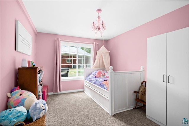 25 Maki Rd, Esko, MN 55733 - carpeted bedroom featuring a chandelier and baseboards