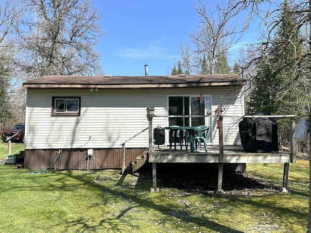 1529 Riddell Rd, Cook, MN 55723 - back of property with a wooden deck and a yard