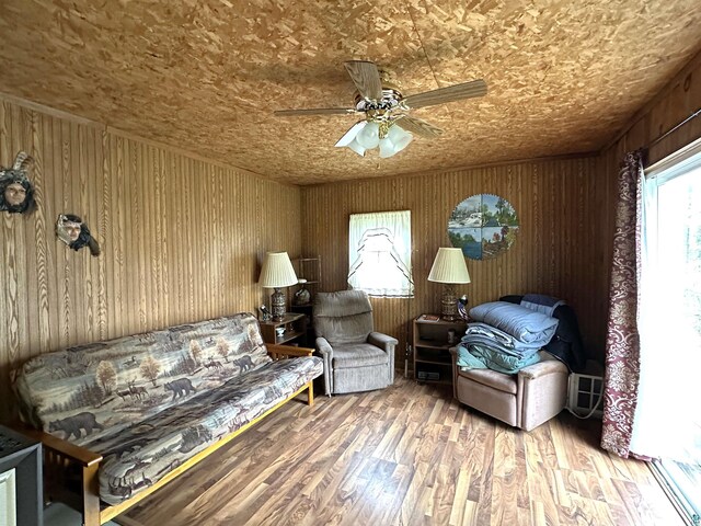 1529 Riddell Rd, Cook, MN 55723 - living area with a ceiling fan, wood finished floors, and wood walls