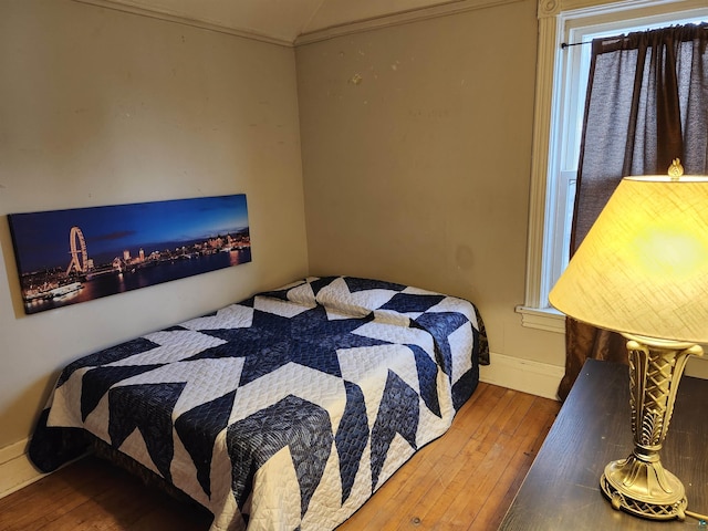 5806 Wadena St, Duluth, MN 55807 - bedroom featuring hardwood / wood-style flooring, baseboards, and lofted ceiling