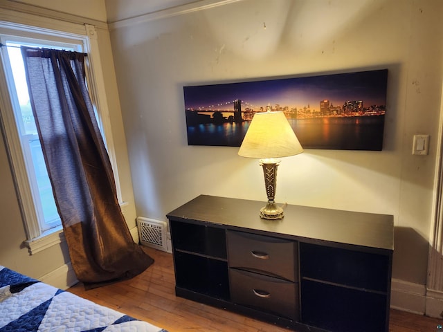 5806 Wadena St, Duluth, MN 55807 - bedroom with wood finished floors, multiple windows, and baseboards