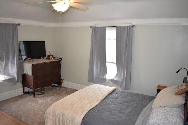 bedroom with baseboards and ceiling fan