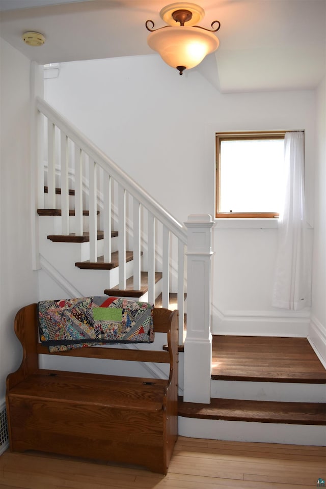 stairs with wood finished floors